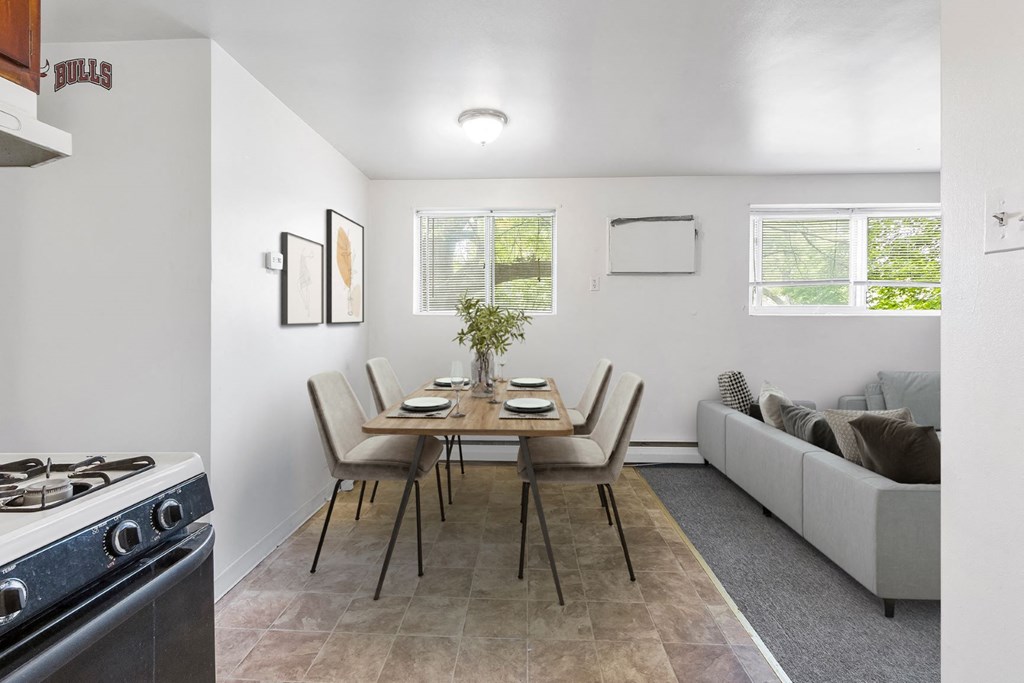 a kitchen with a dining table and a stove