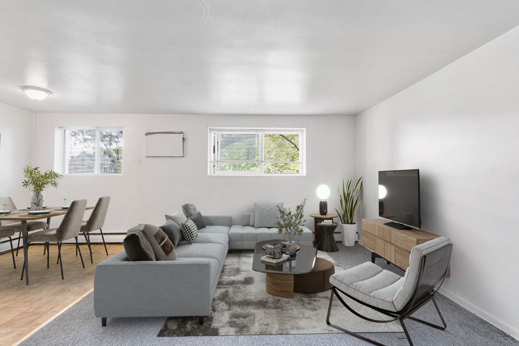 a living room with a couch and a table and a tv