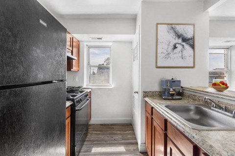 a kitchen with a sink and a refrigerator