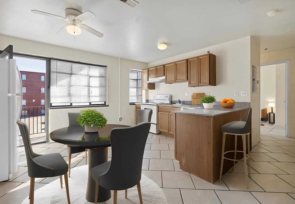 an open kitchen and dining area with a table and chairs