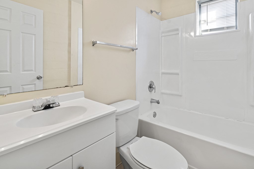 a bathroom with a sink toilet and a shower