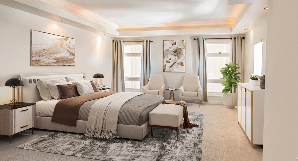 a bedroom with a bed and two chairs and a rug