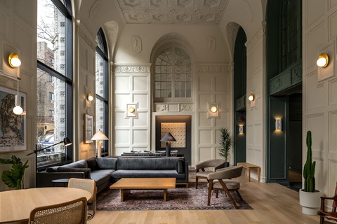 a living room with a couch and a fireplace