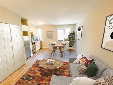 a living room and dining room with a table and a couch