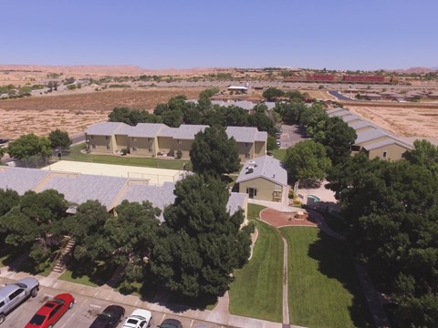 an aerial view of a neighborhood with houses and cars parked