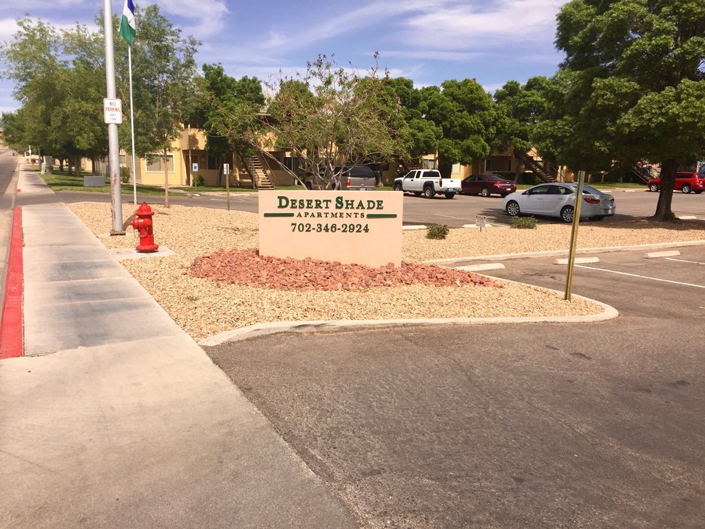 a sign for a dental clinic in a parking lot