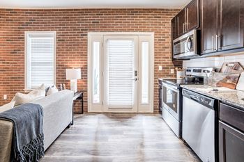 Fully Equipped Kitchen Includes Frost-Free Refrigerator, Electric Range, & Dishwasher, at The Foundry, South Bend, IN 46617