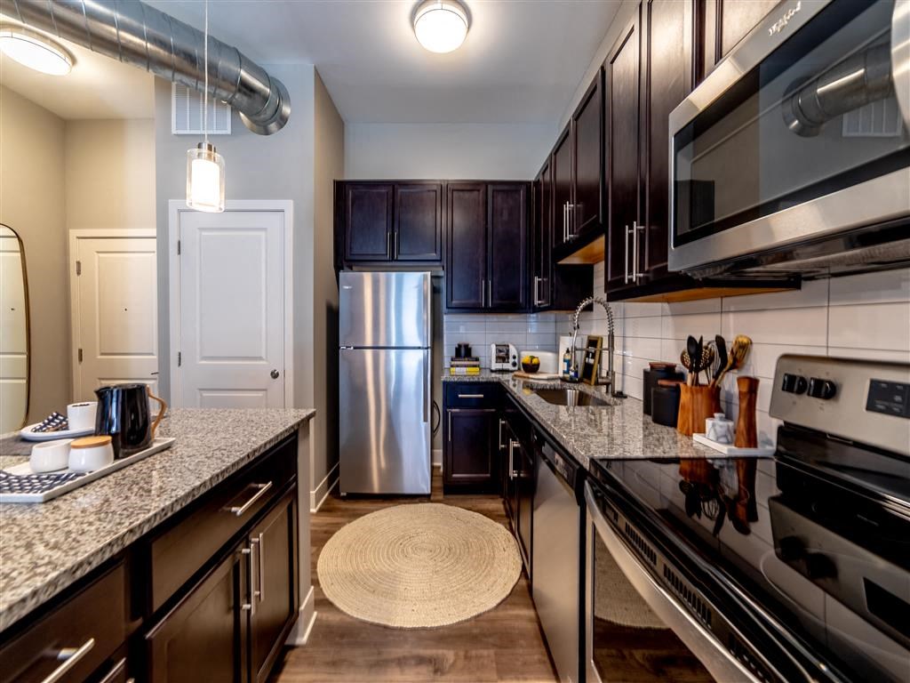 Fully Equipped Kitchen Includes Frost-Free Refrigerator, Electric Range, & Dishwasher at The Foundry, South Bend, 46617
