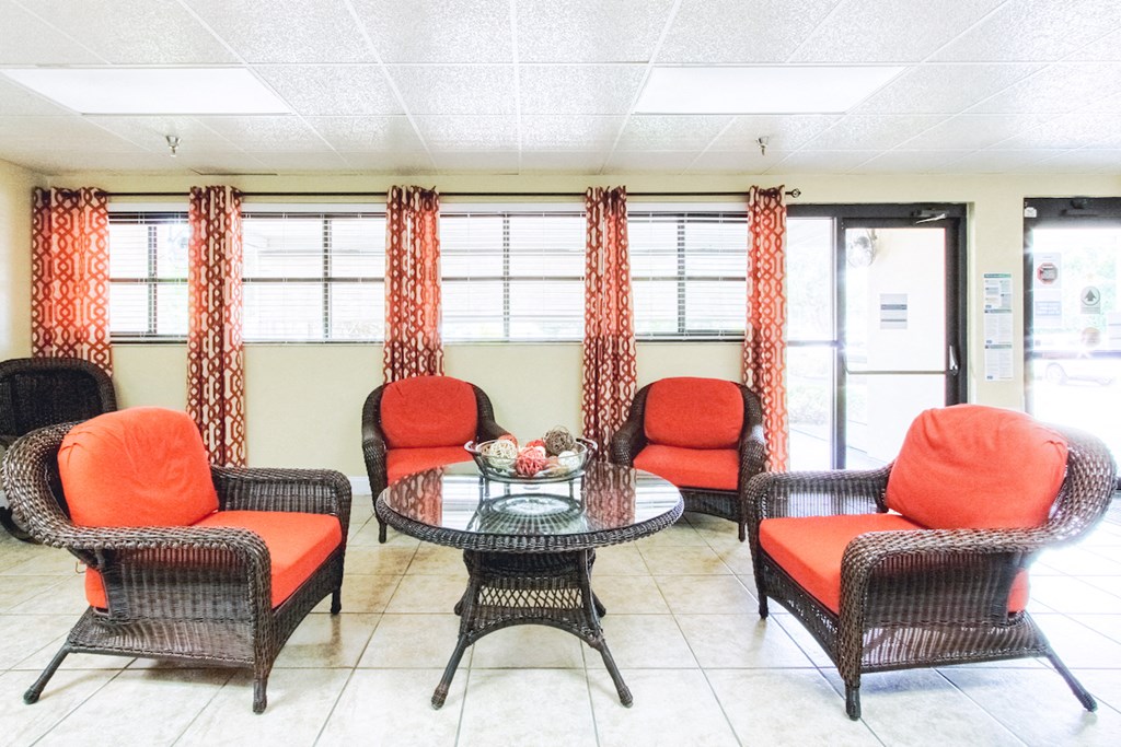 VSCII-Lobby lobby with chairs, table, and sofa by bank of windows
