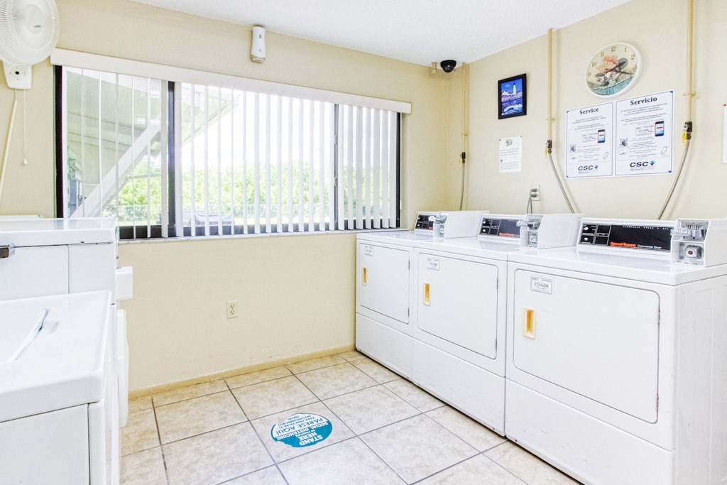 laundry room with washers and dryers