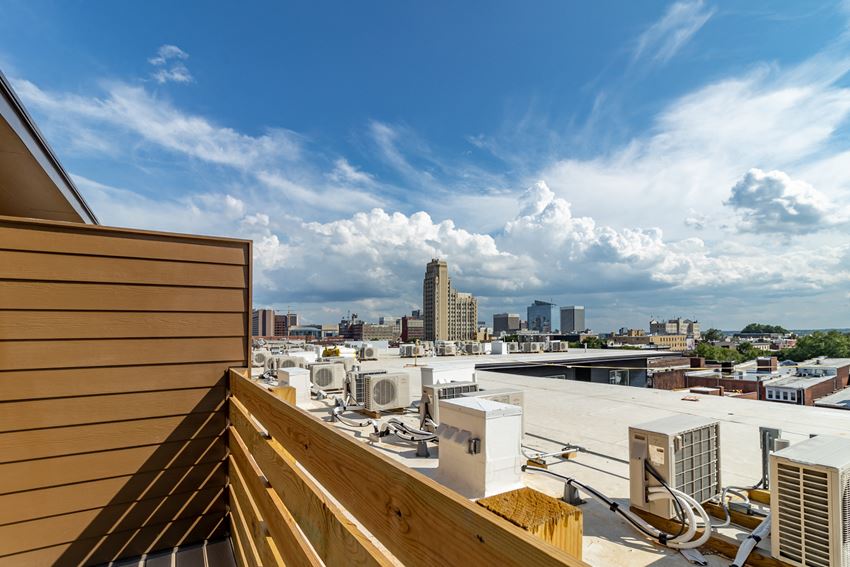 the view of the city from the roof of a building