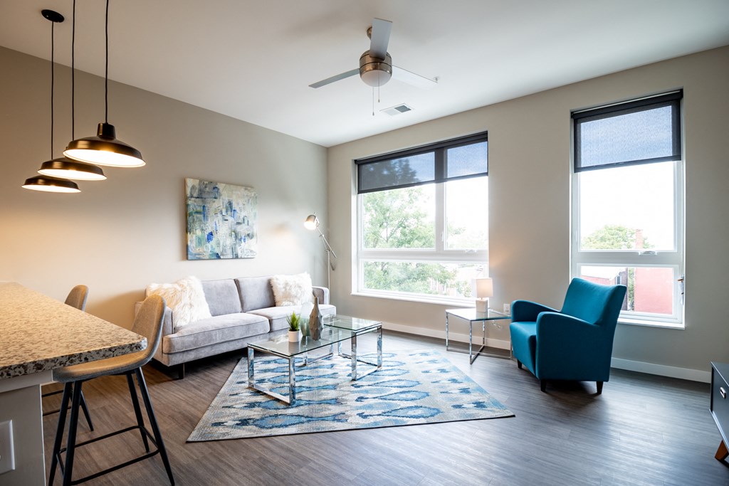 a living room with a couch and a chair and a table