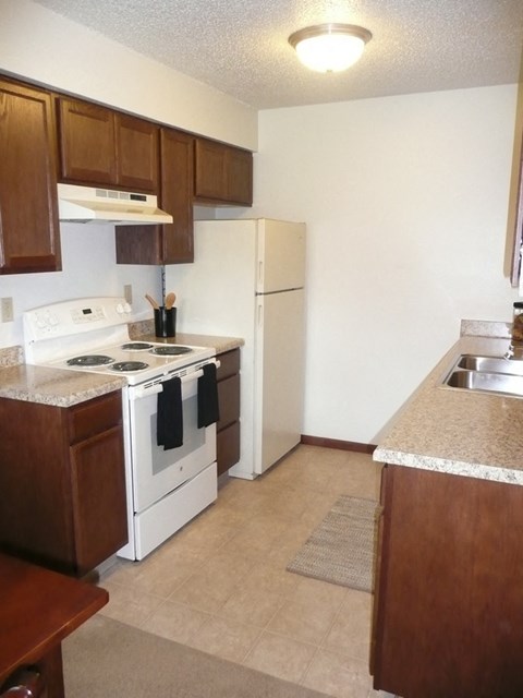 Modern Kitchen With Stainless Steel Appliances And Double Door Refrigerators at Parkside Manor, Coralville, IA