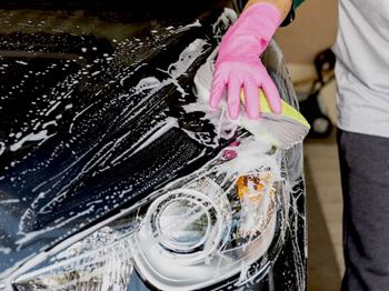 Person washing a car