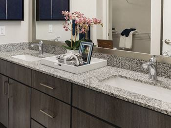Double sink bathroom vanity with granite countertops