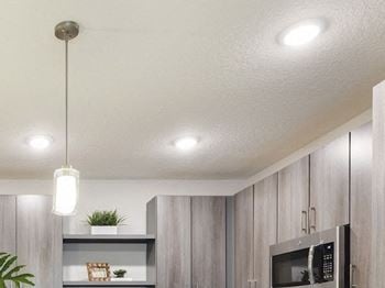 Fashionable pendant and recessed lighting in kitchen