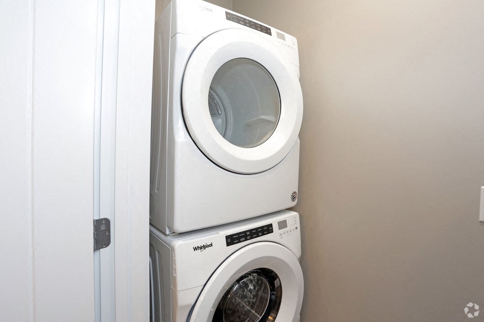 a washing machine and a dryer in a laundry room