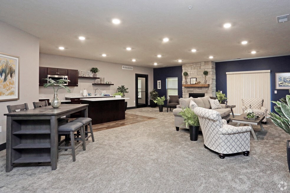 a large living room with a kitchen and a dining room