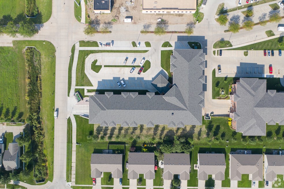 a birds eye view of a neighborhood with houses and lawns