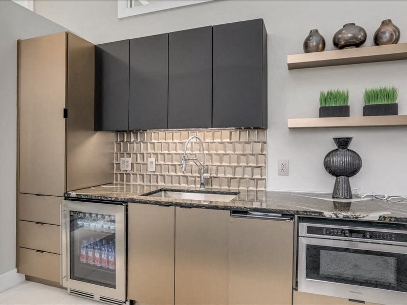a kitchen with stainless steel appliances and a sink