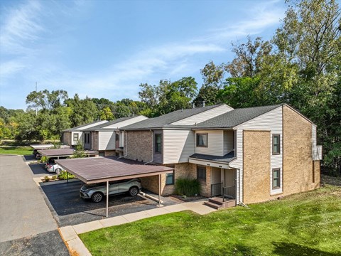 a row of houses with trailers in a parking lot