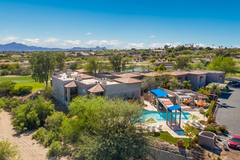 a aerial view of a neighborhood with a pool and houses