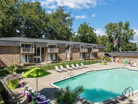 our apartments have a large pool and a courtyard with chairs