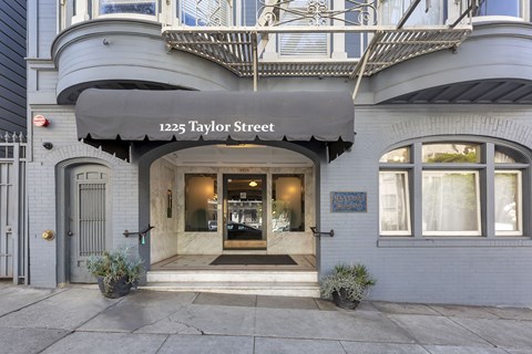 The entrance to a building with a sign that reads "1225 Taylor Street".