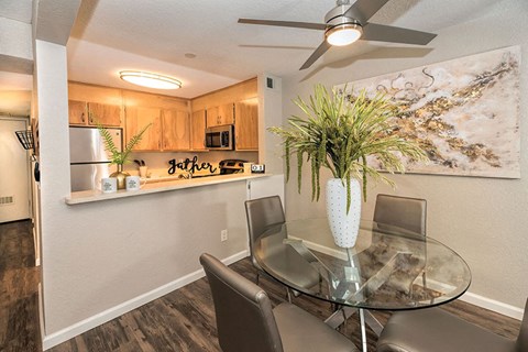 Dining area with ceiling fan off of kitchen area
