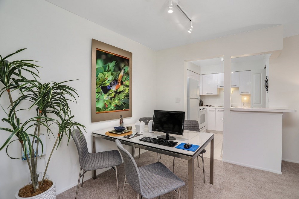 a home office with a desk and a computer