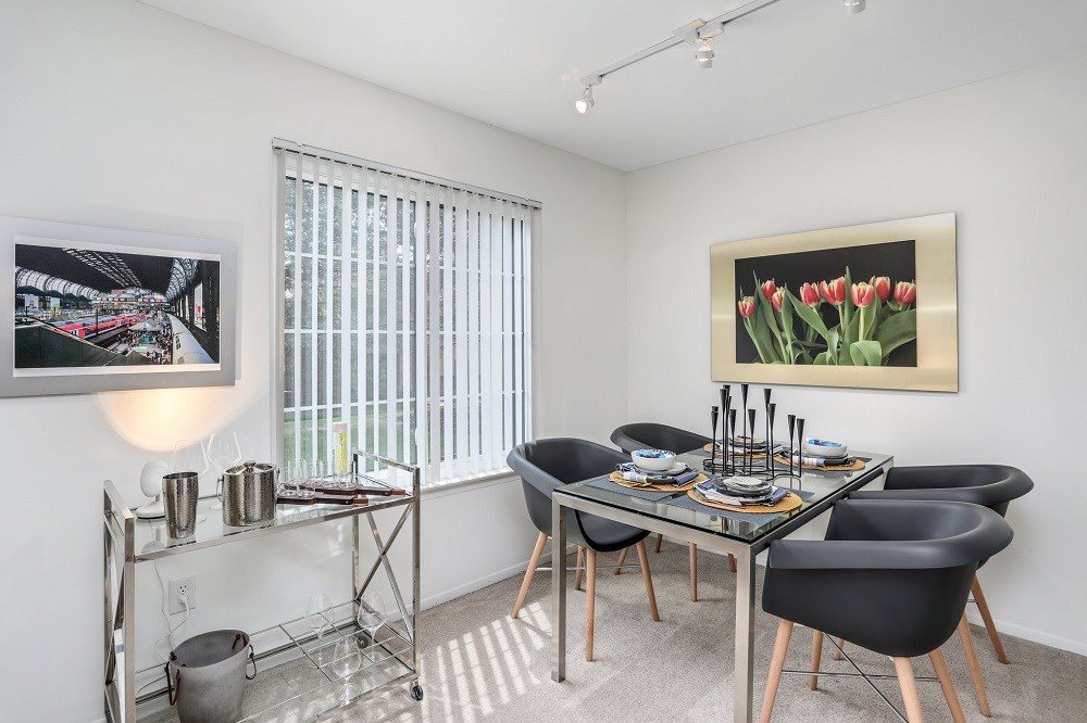 a dining room with a table and chairs