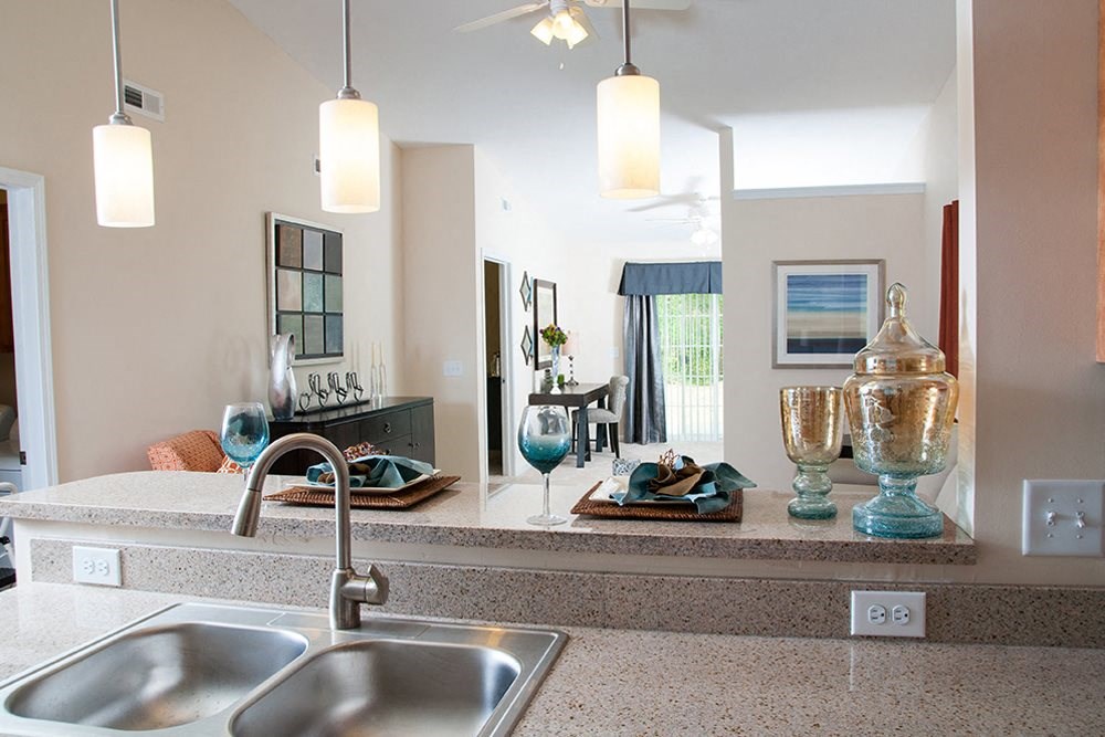 a kitchen with a sink and a counter top