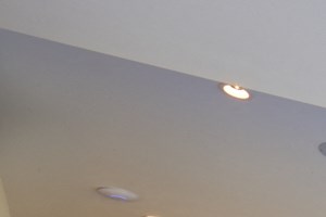 a large living room with a ping pong table