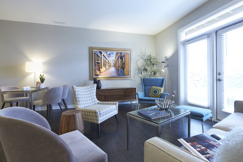 a living room with a couch and chairs and a table