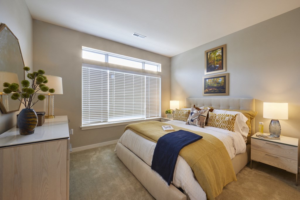 a bedroom with a large bed and a window