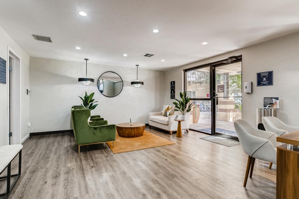 a living room with white walls and a sliding glass door