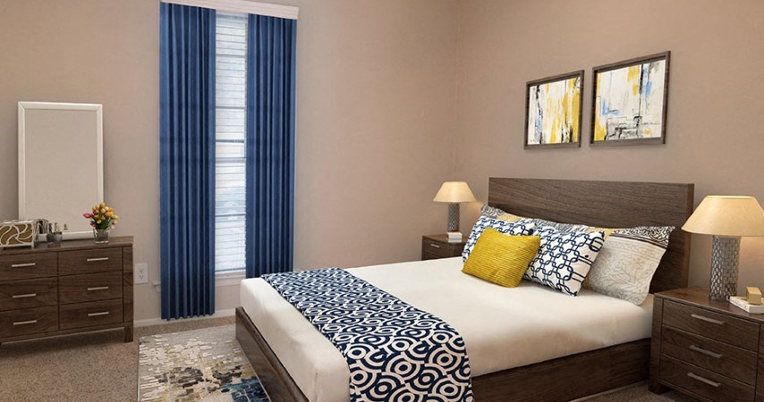 a bedroom with a bed and two windows