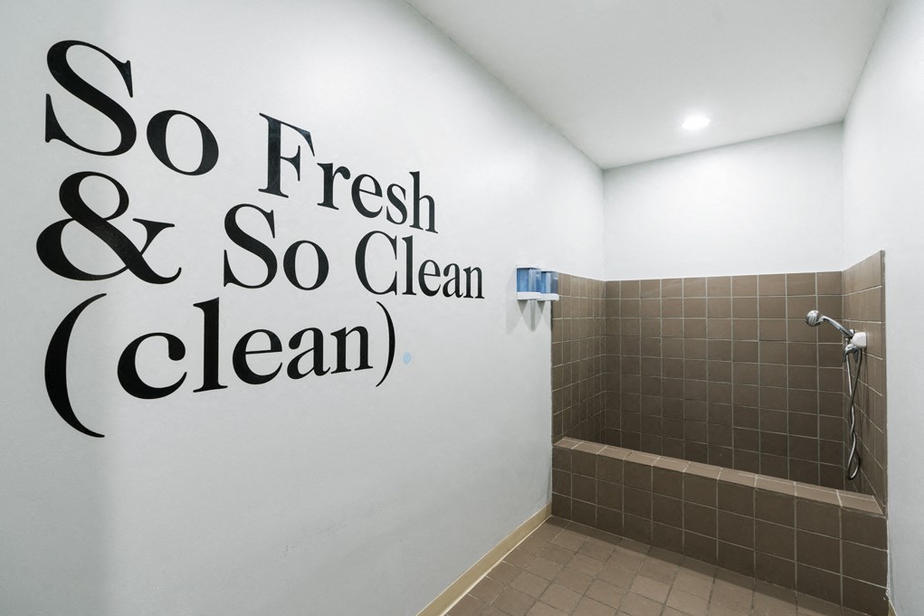a bathroom with a quote on the wall  so fresh and so clean