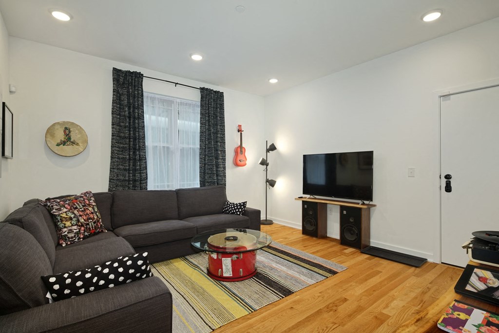 a living room with a couch and a tv