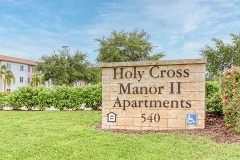 a sign apartments in front of a building