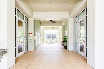 lobby area of St. Anthony Garden Court with mailboxes and water fountain