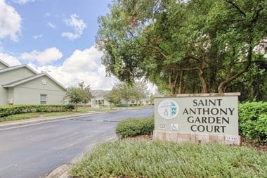 Monument sign for Saint Anthony Garden Court at entrance to community