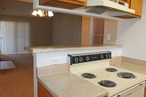 a kitchen with a stove and a counter top