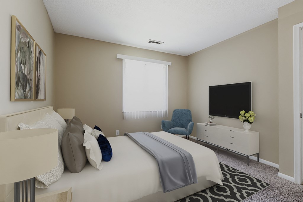 a bedroom with a large bed and a tv on the wall