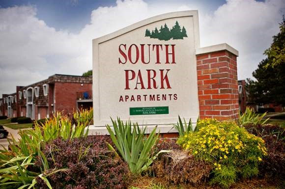 a sign apartments in front of a building