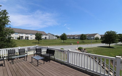 A sunny second-floor balcony.