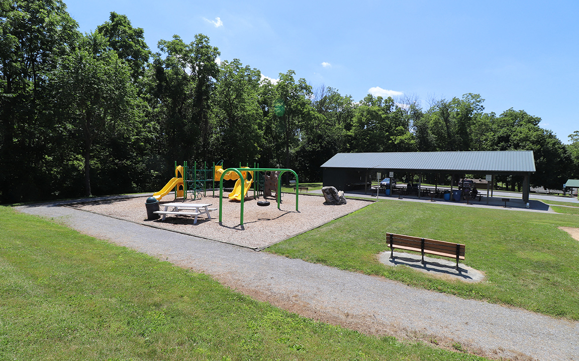 a park with a playground and a pavilion