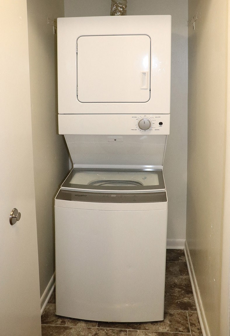 a washer and dryer in a small closet