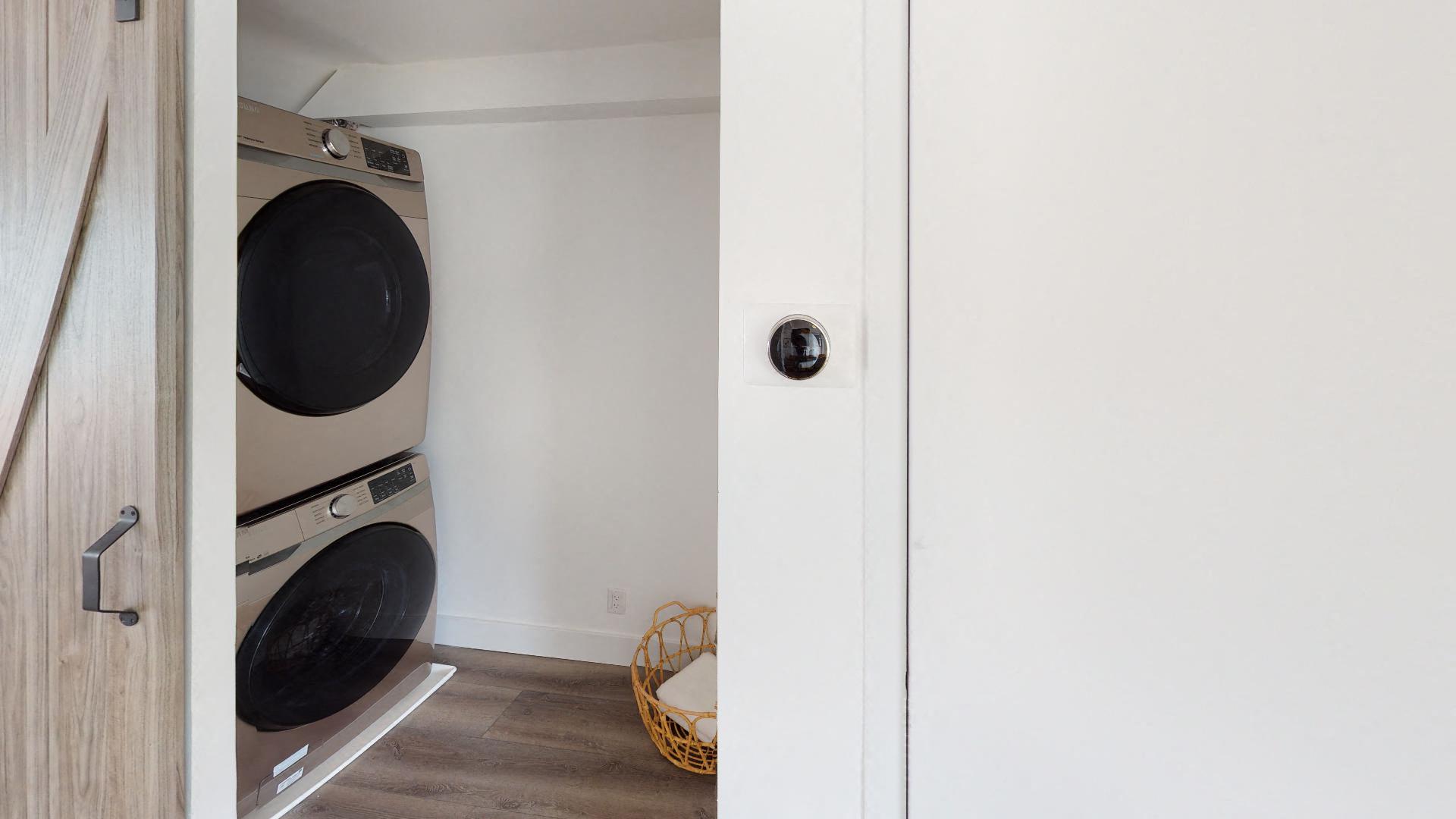 a small laundry room with a washer and dryer