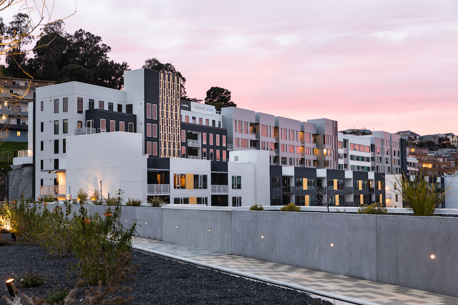 a view of a building with a sunset in the background